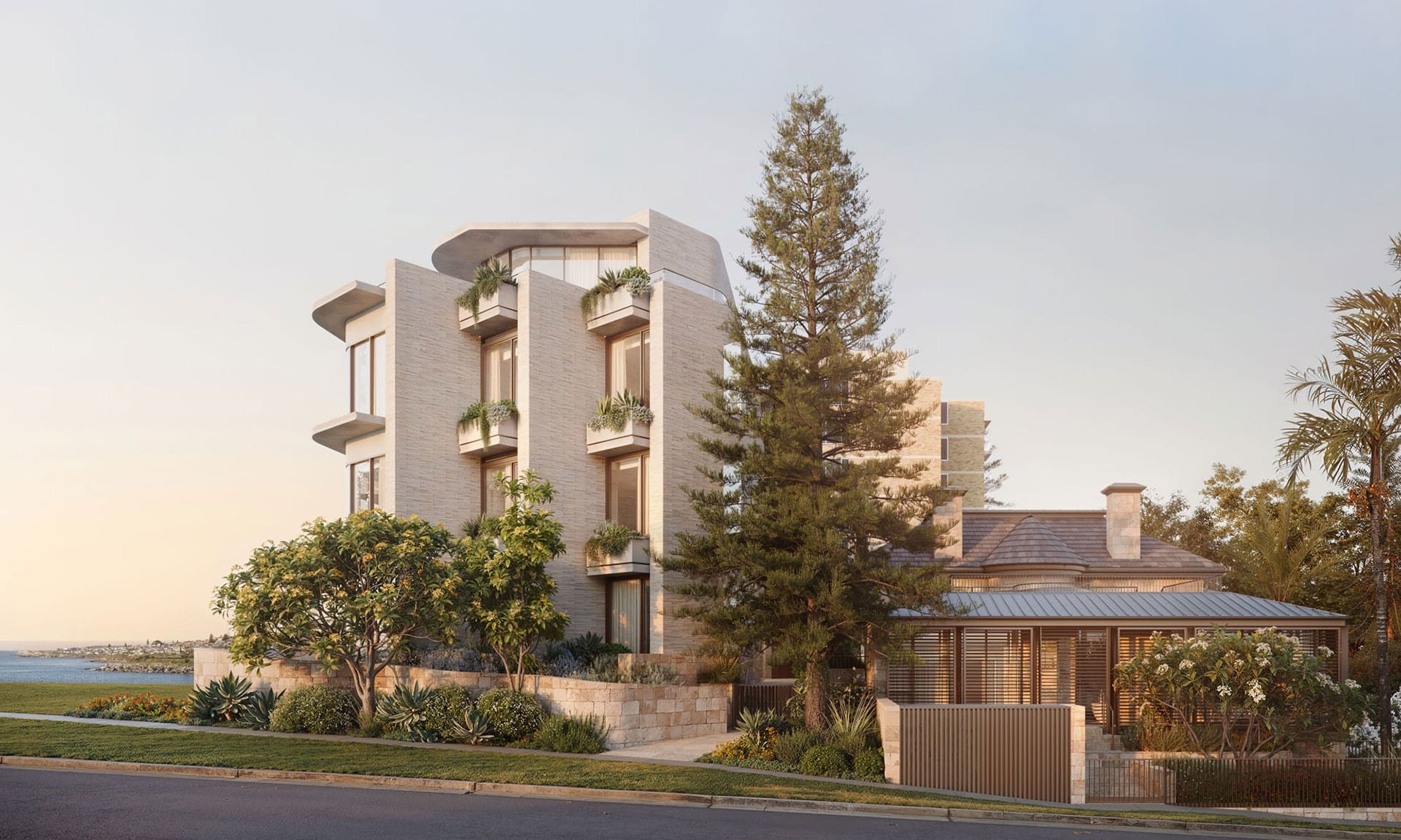The modern multi-story Ballamac House, with its large windows and surrounded by lush trees and plants, stands proudly near a tranquil body of water under the clear sky in NSW.