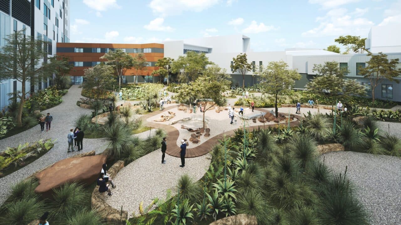 Nestled near Kingswood, this landscaped urban park offers pathways, trees, and lush greenery. Visitors stroll and socialize under a partly cloudy sky, enjoying a serene escape close to Nepean Hospital.